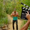 DALL·E 2023-01-27 19.42.07 - a photo of a contestant from australian survivor in the forest wa...png
